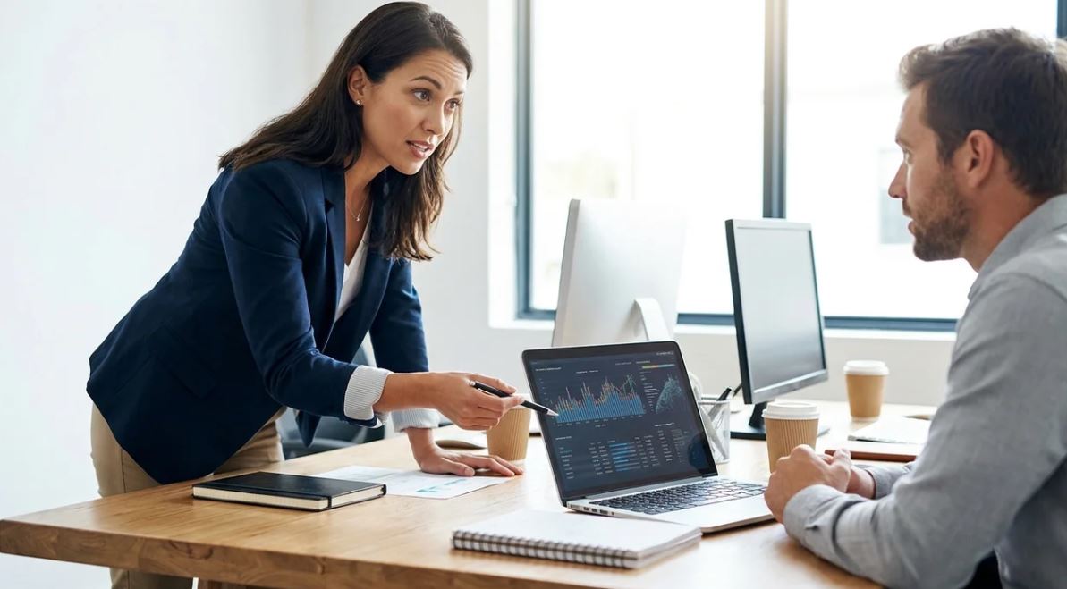 Employee asking question using “just to clarify” in professional office discussion.