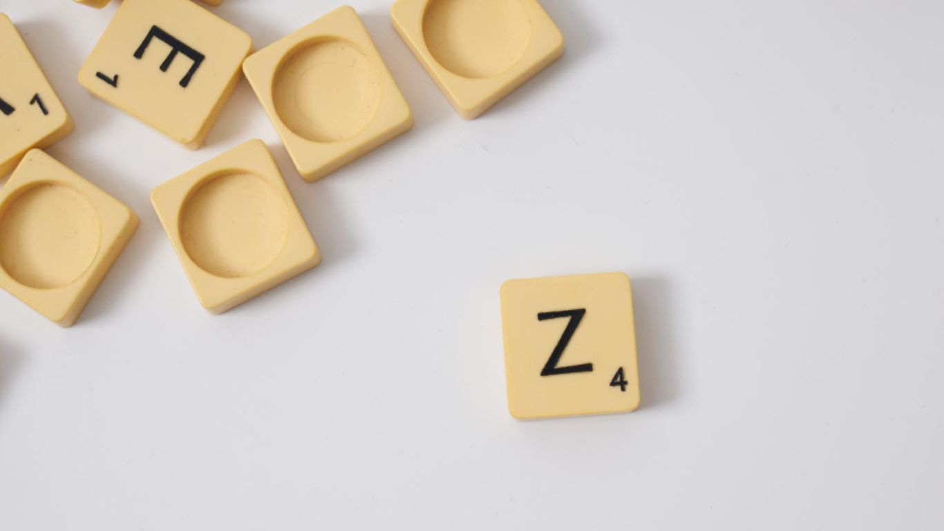 A graphic showing various English letters scattered around with the letter “Z” highlighted boldly at the center to represent the /z/ sound.